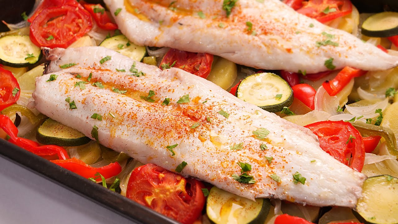 receta de merluza al horno con patatas cebolla y pimientos
